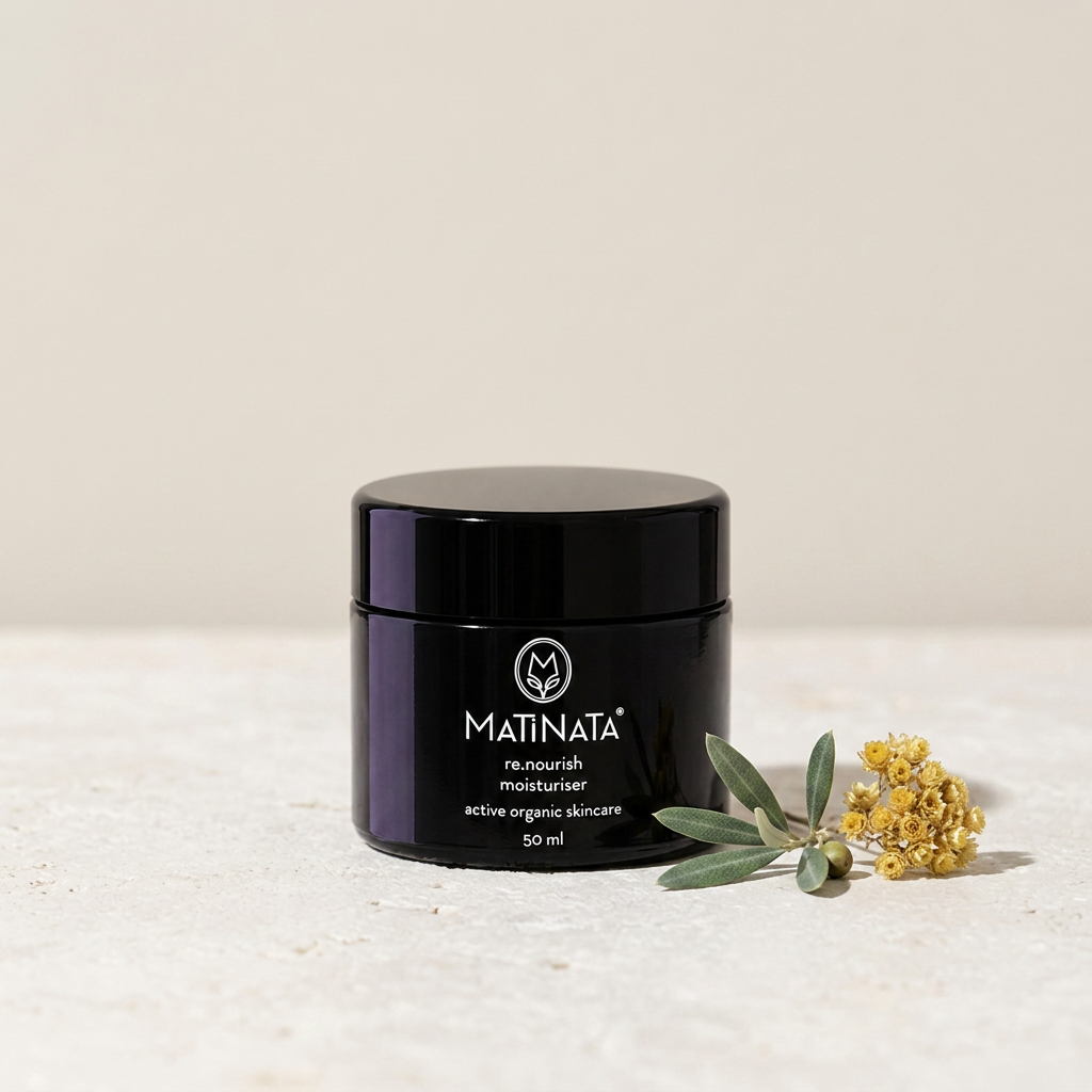 Matinata re.nourish moisturiser jar in violet glass on cool limestone